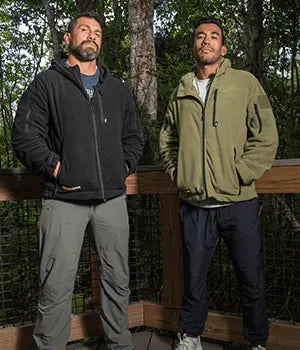 Two men wearing EscapeZone EMF-blocking apparel in the woods
