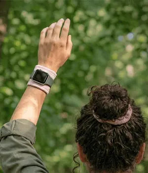 Person wearing EscapeZone EMF body shielding gear outdoors