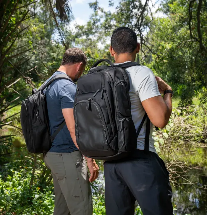 Two hikers carrying the EscapeZone Dual backpack